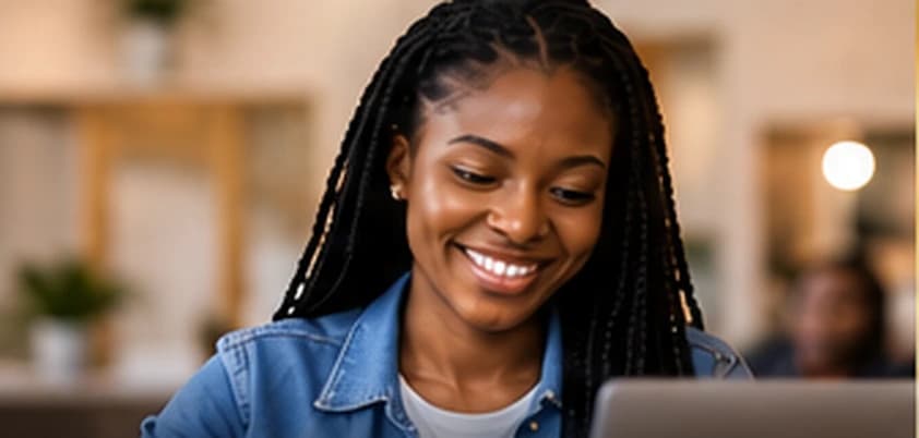 Young Black learner studying online with a laptop